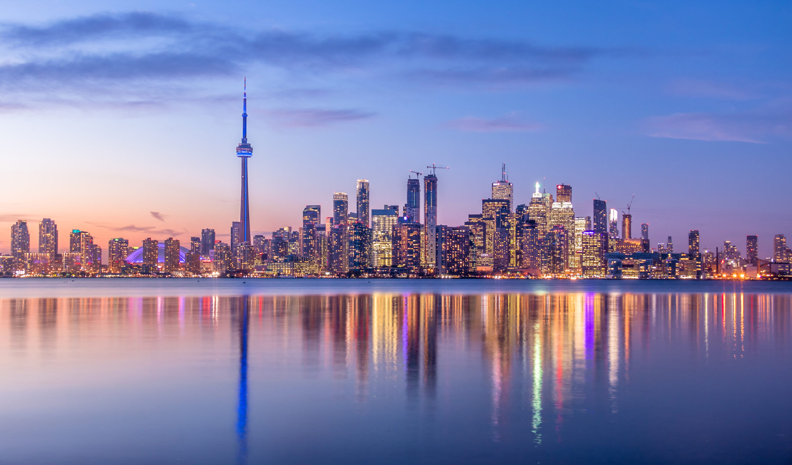 Toronto Translation Services, view of the Toronto Skyline with purple light